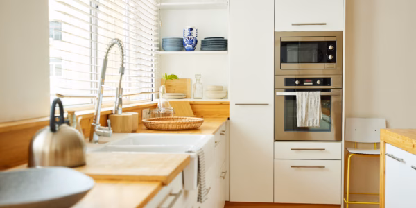 Sink with faucet on kitchen counter by window